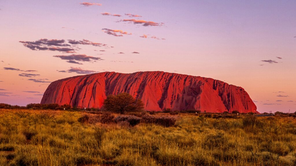 Winter is the the best time to visit Australia's Northern Territory to catch Uluru glowing red at sunset.