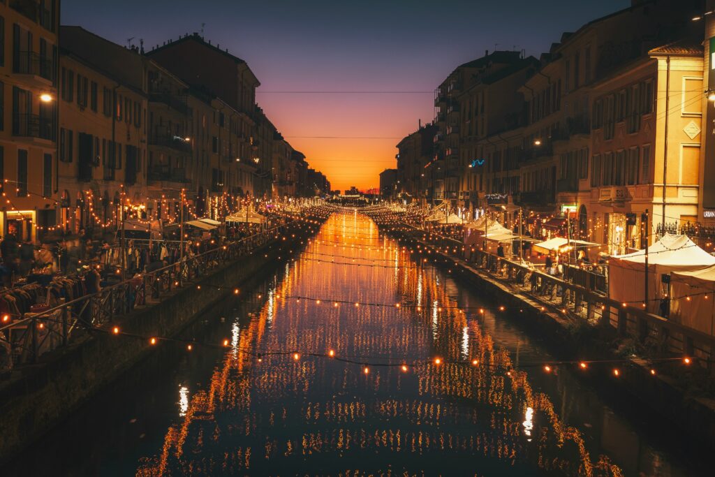 Evening lights along Naviglio Grande canal in Milan during winter.